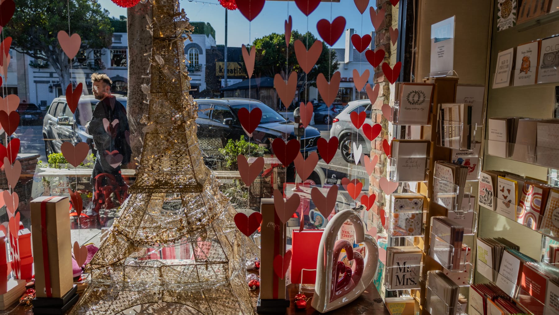 Gold Eiffel Tower and red paper hearts in the Village Heights window